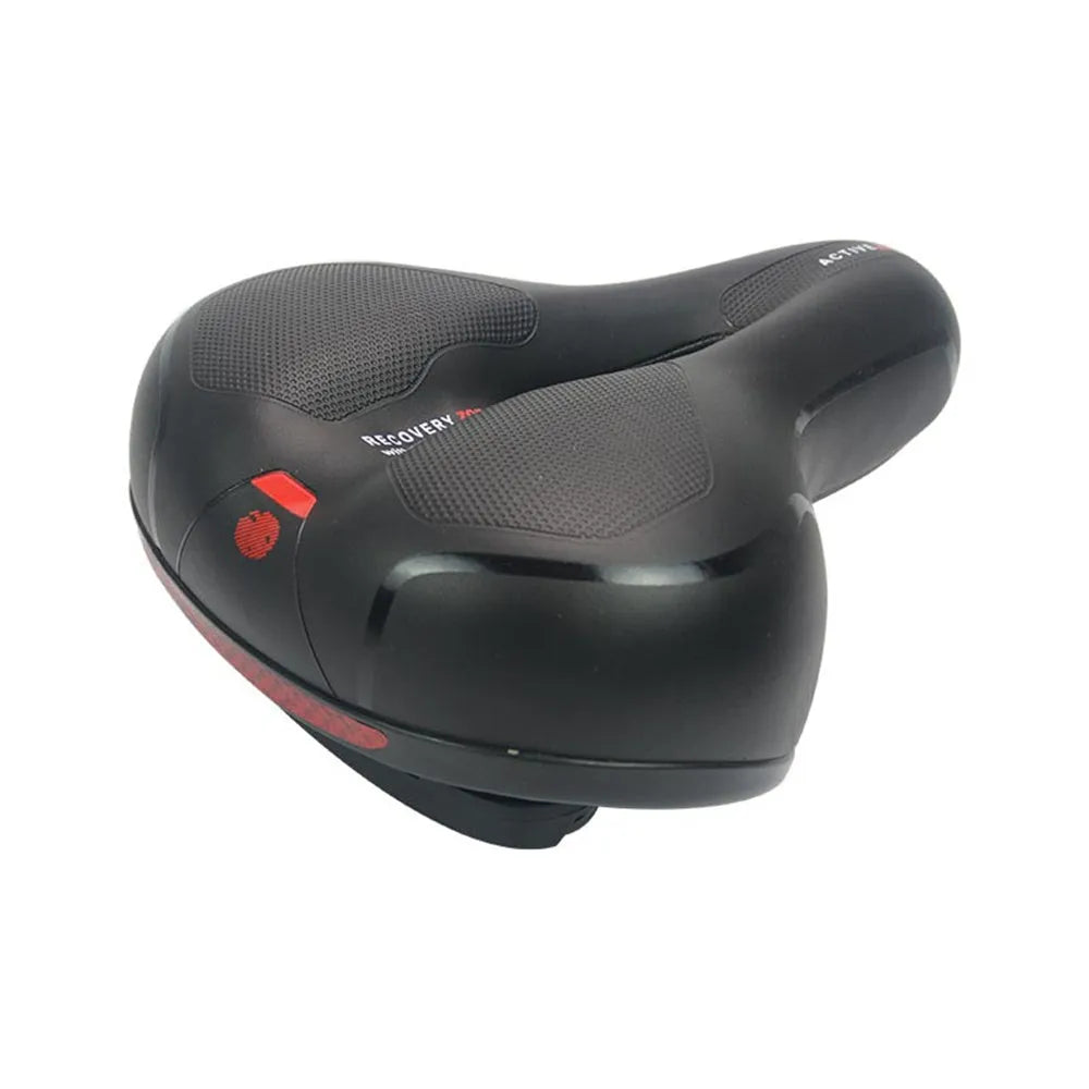 Black bicycle saddle with silicone padding and two visible steel springs underneath, shown with a waterproof cover and tools.