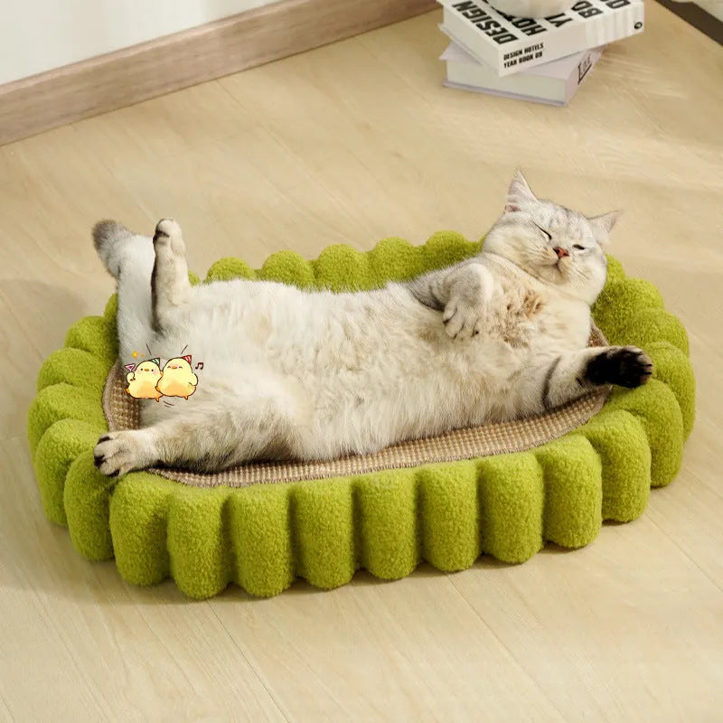 Green oval cat scratching pad and bed made from sisal fibre.