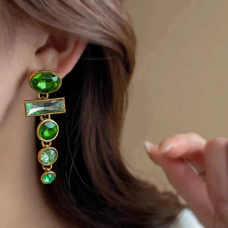 Pair of green gradient geometric alloy earrings with a tassel and inlaid zircon stone details on a white background.