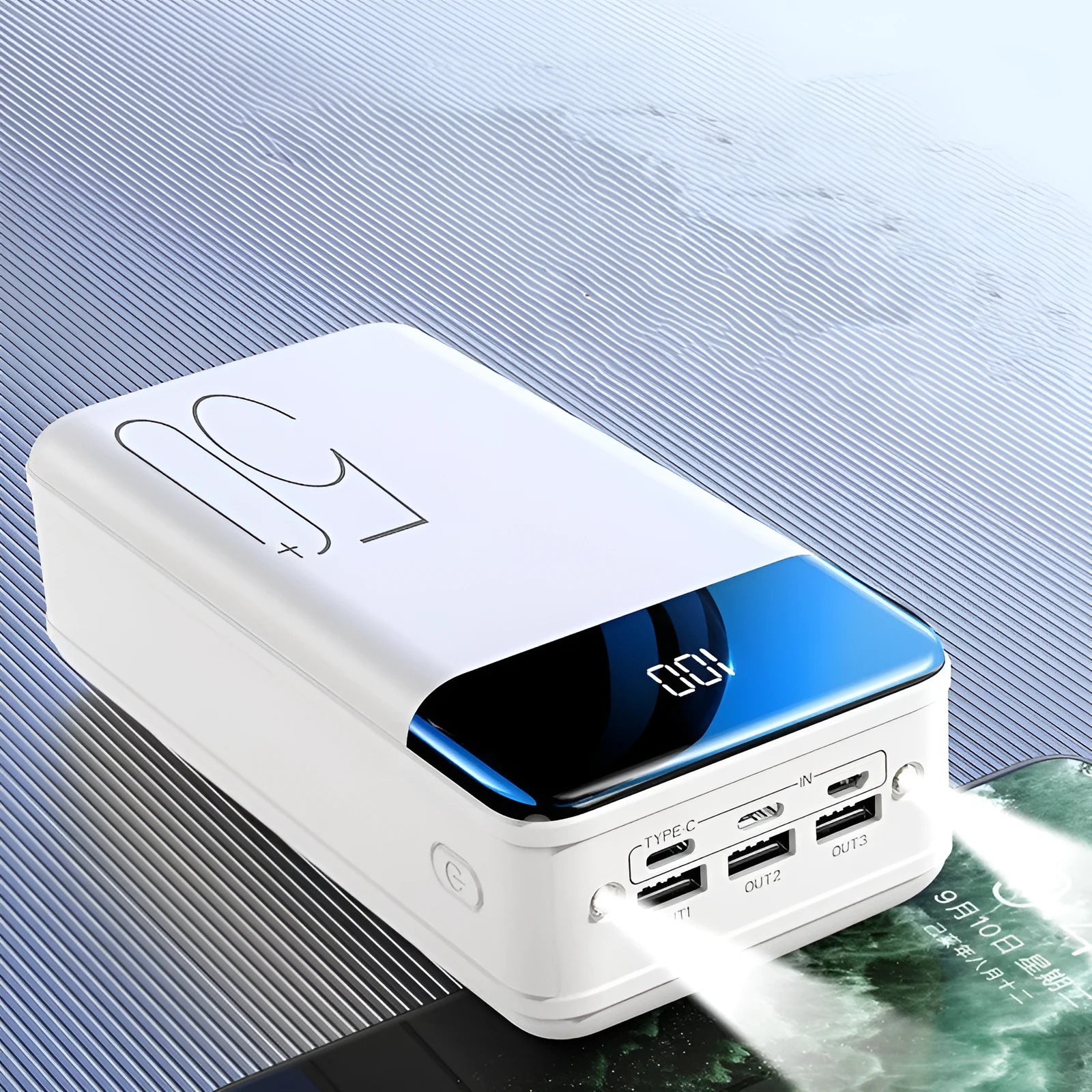 Black large capacity 50000mAh power bank with multiple USB ports on a white background