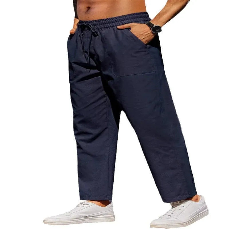 Men's straight-leg linen casual trousers in apricot colour with an elastic waistband.