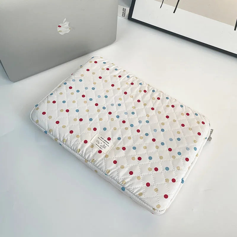 Polka dot patterned laptop bag for women, shown in available sizes for 11-inch to 15.6-inch laptops.