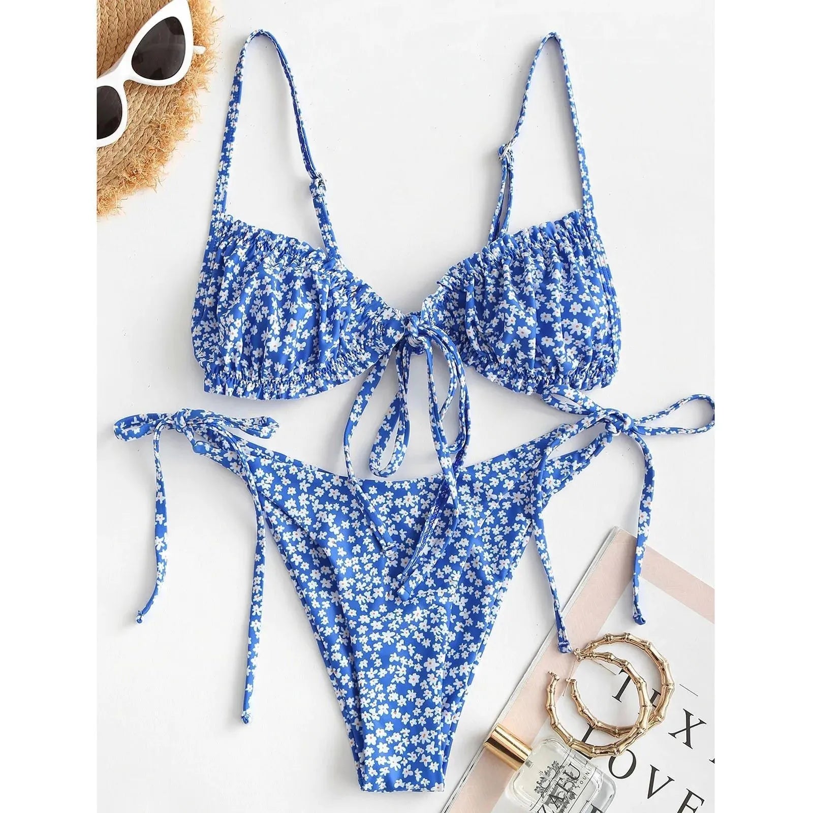 Blue printed women's bikini with multi-rope banding detail on short sleeves and lapel collar.
