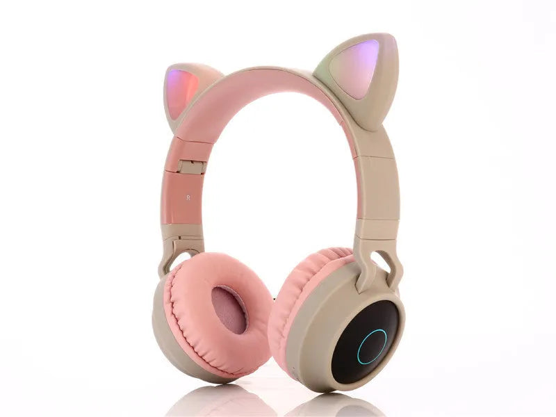 Cartoon cat ears wireless Bluetooth gaming headset shown in one of five colours: green, light blue, pink, purple, or skin tone.