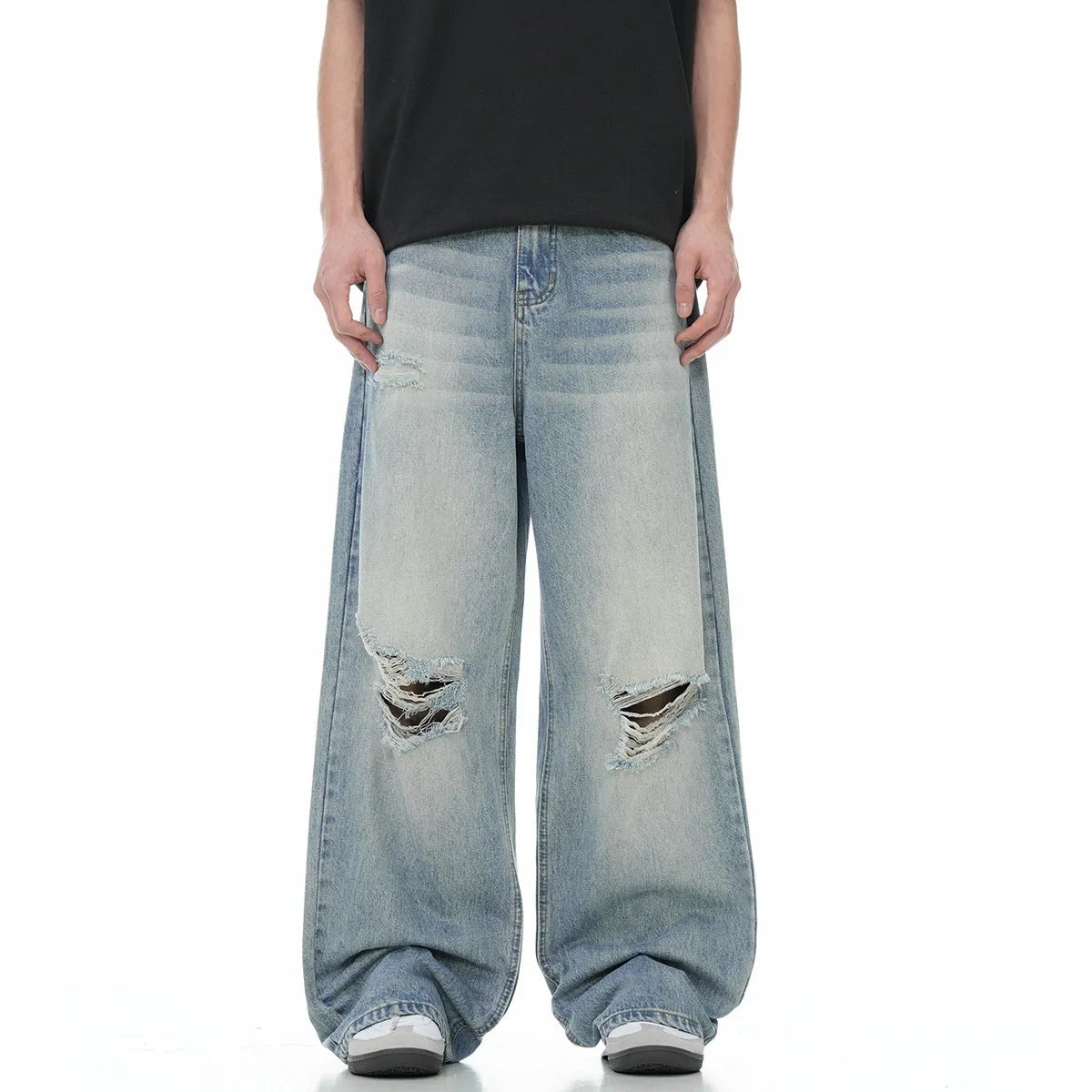 Blue men's straight-leg jeans with ripped detailing and a zip fly on a plain background.
