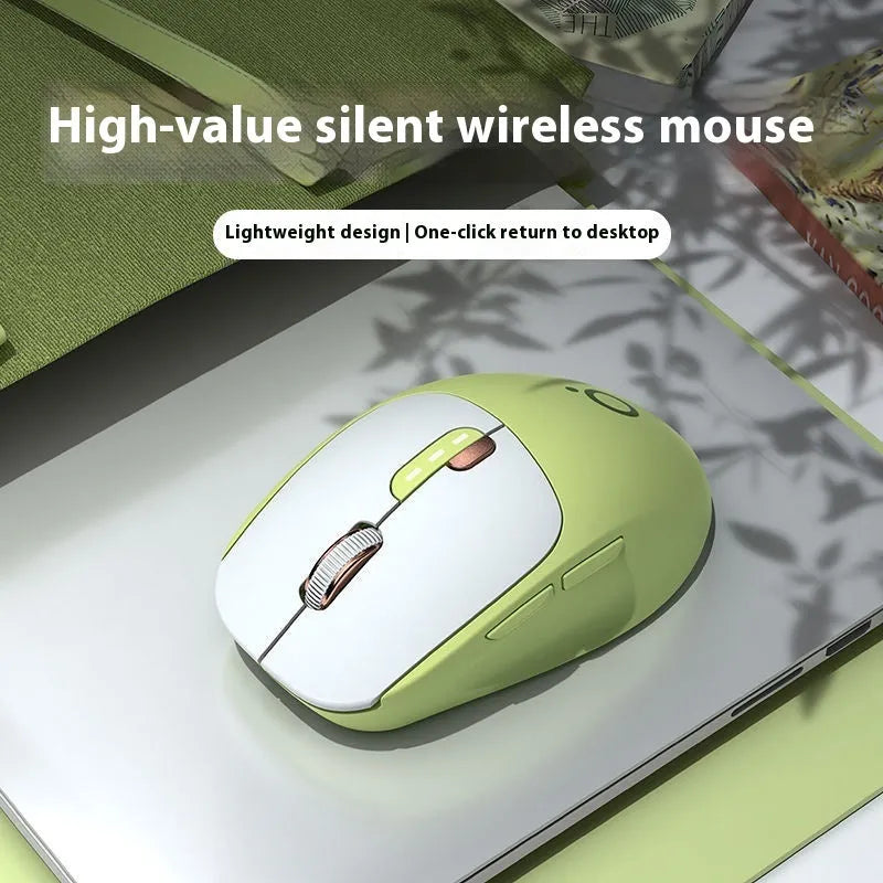 Mute wireless Bluetooth and 2.4GHz computer mouse in Matcha Green colour on a wooden desk
