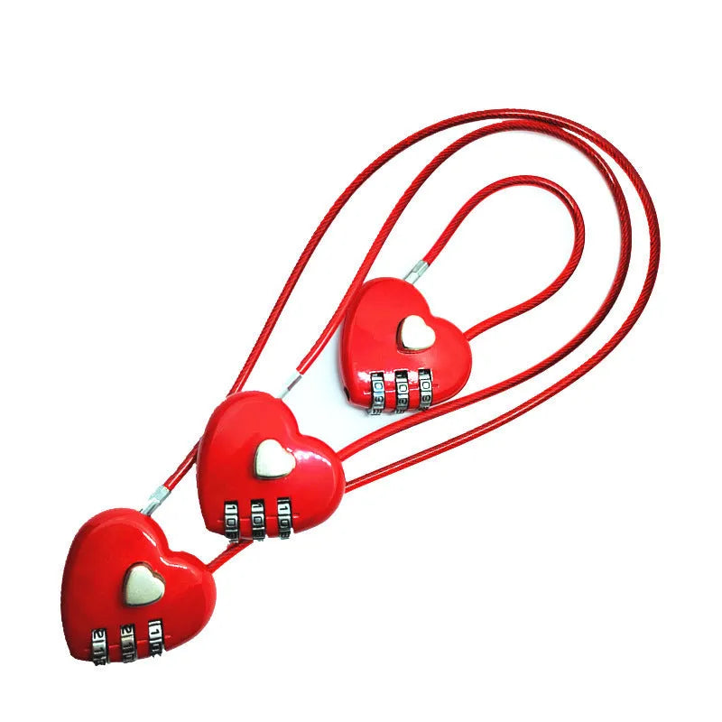 Peach heart-shaped wire rope padlock with a coiled steel cable, shown in various colours.