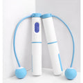 Smart cordless skipping rope with counter in blue or black plastic, cordless ball design for home fitness