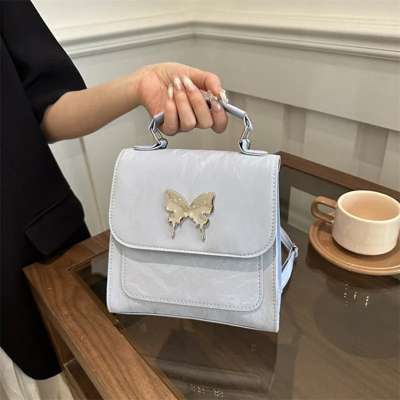 Women's preppy style PU synthetic leather backpack with bow detailing in six colour options
