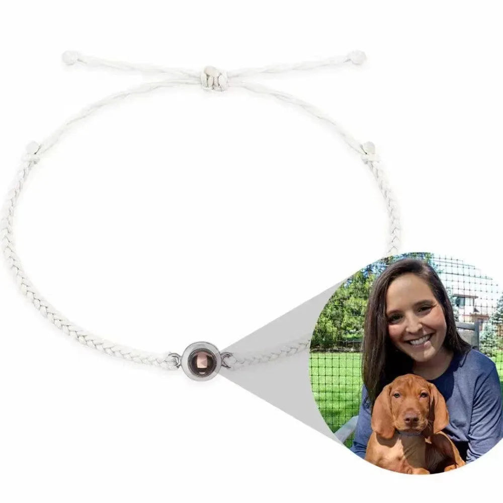 Personalised photo projection bracelet with green leaf fine band and diamond accents, round copper case, available in multiple colours.