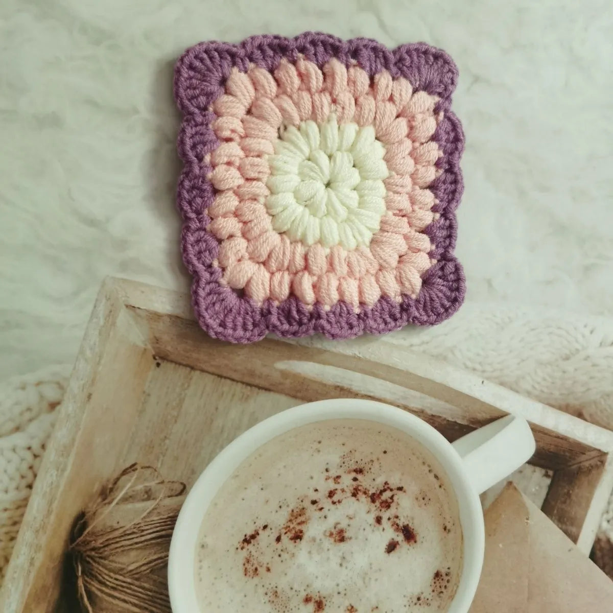 Crocheted wool insulated cup placemat with grandmother lattice pattern in choice of colours