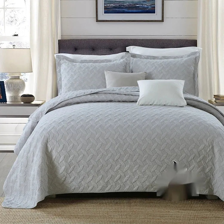 Double-sided pure cotton bed cover three-piece set in a light grey damascus pattern on a bed.
