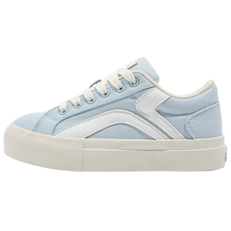 Minority women's low top board shoes in black and white colourway, synthetic leather upper, round toe.