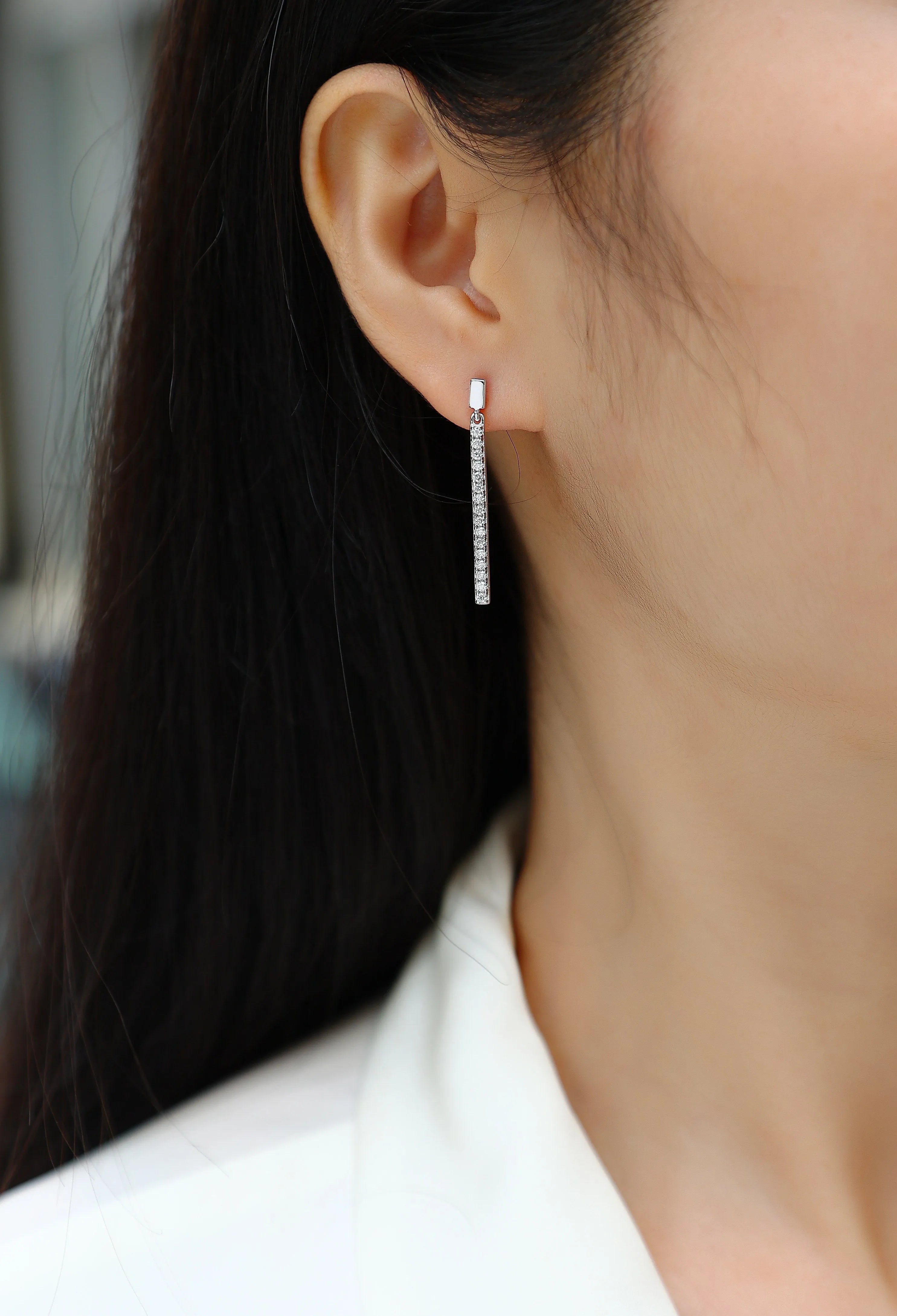 Pair of moissanite stud earrings in S925 silver with platinum plating on white background
