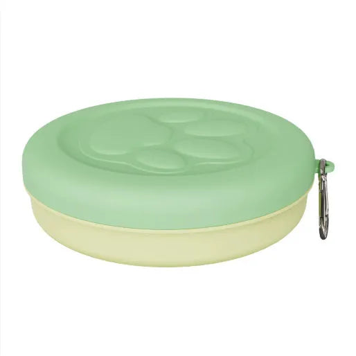 Collapsed and open views of a pink silicone dog bowl with matching sealing lid, next to a dog lead.