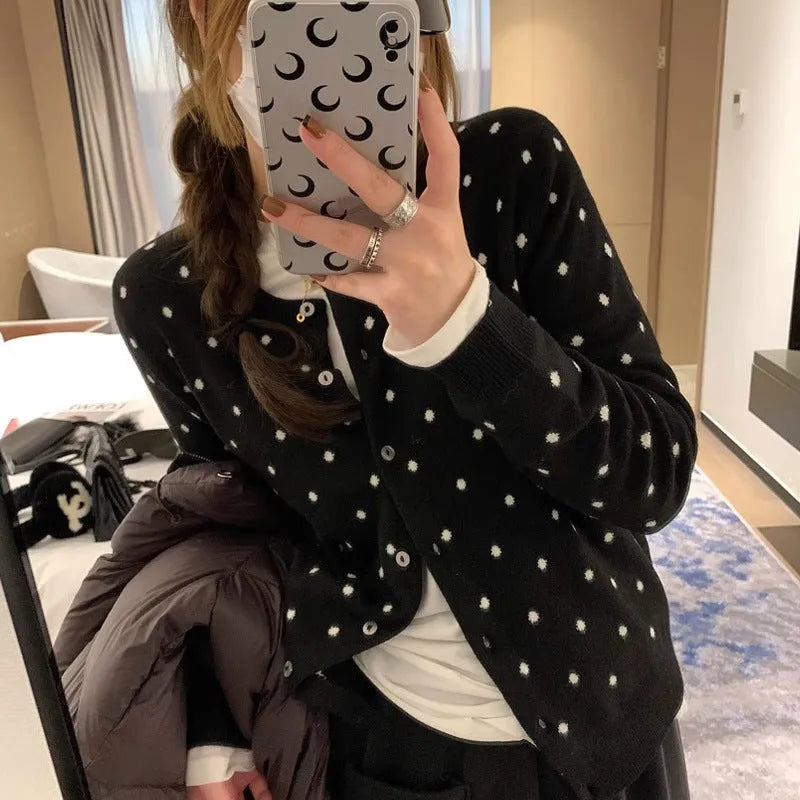 Women's grey dot pattern knitted cardigan with crocheted flower details on front