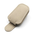PU leather car sunglasses holder clip attached to a sun visor in beige colour