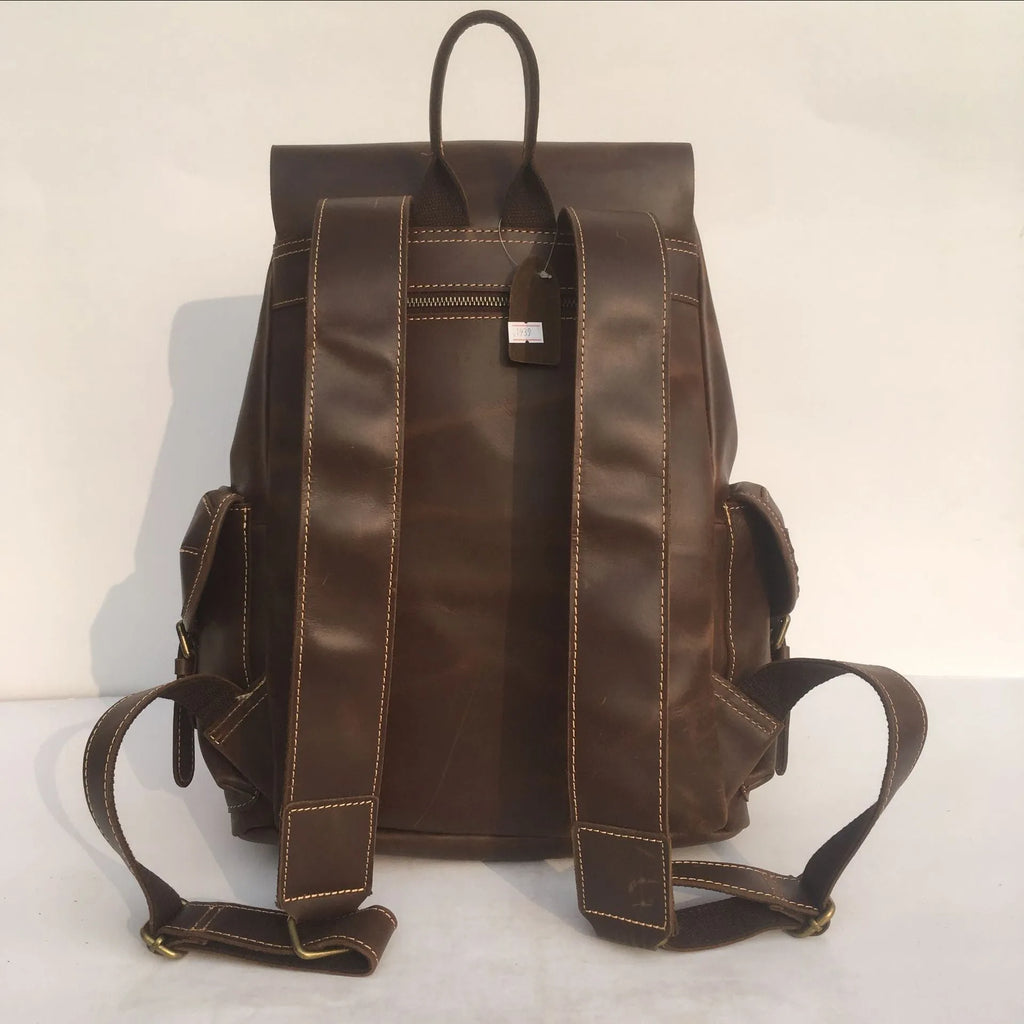 Brown men's cowhide leather backpack with air pillow shoulder straps and a single main compartment.