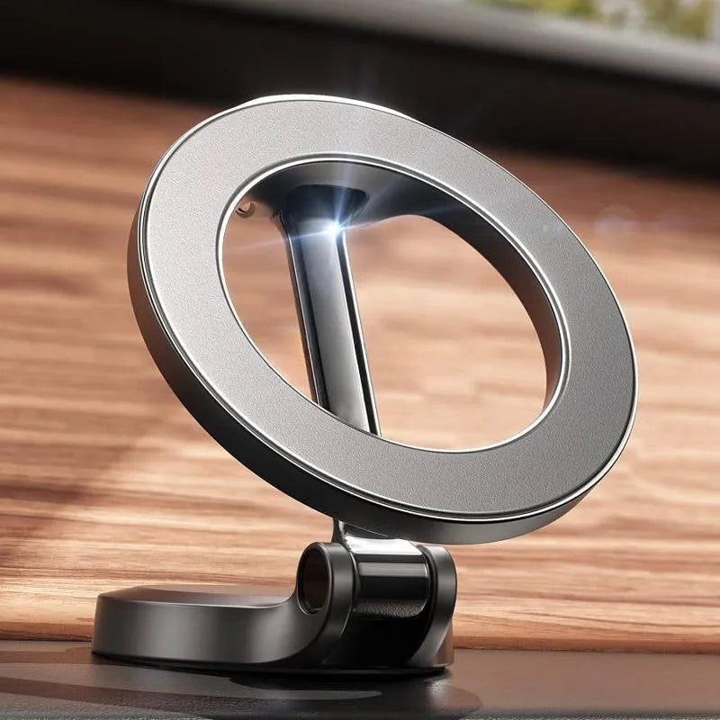 All-metal foldable magnetic car phone mount in Qian colour, shown on a dashboard.