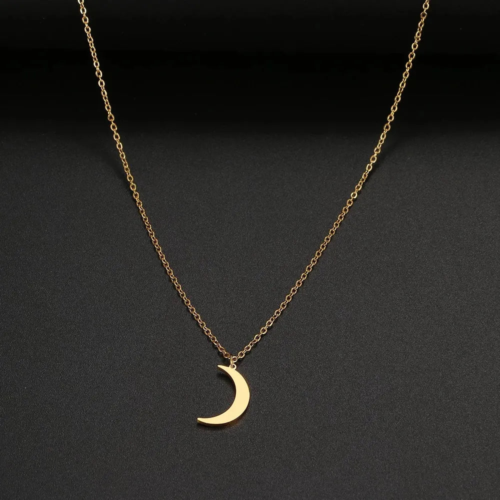 Women's stainless steel moon pendant necklace on a clavicle chain in gold or silver electroplated finish