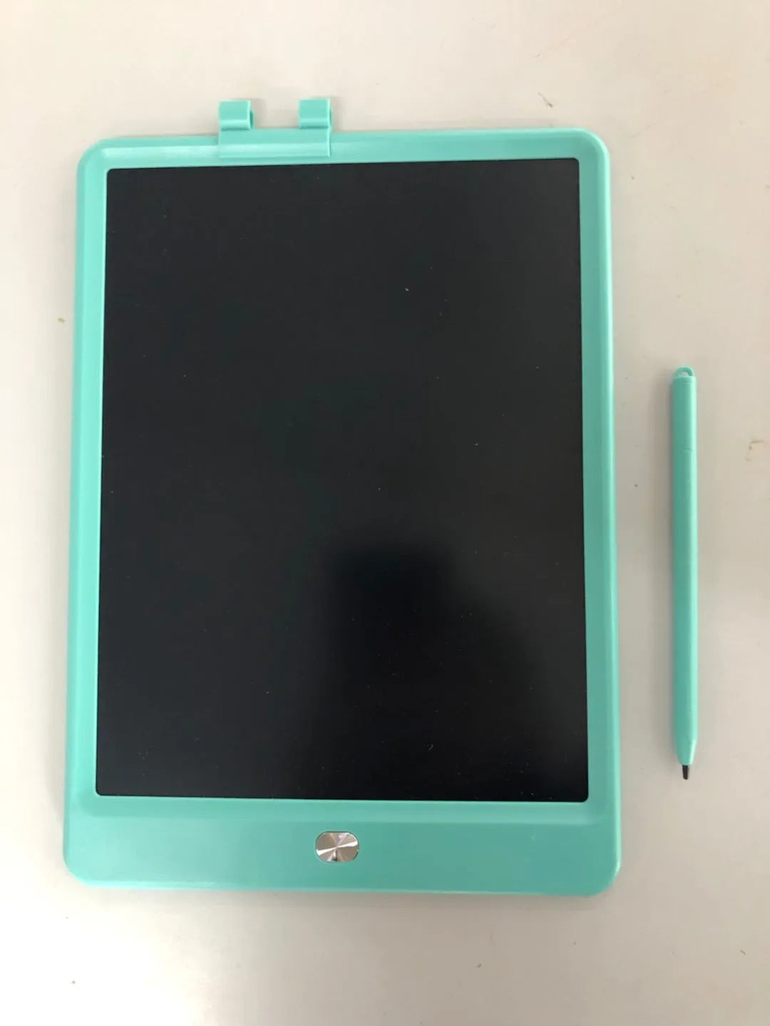 10 Inch Children's LCD Writing tablet with colourful screen, blue bezel, and stylus on white background