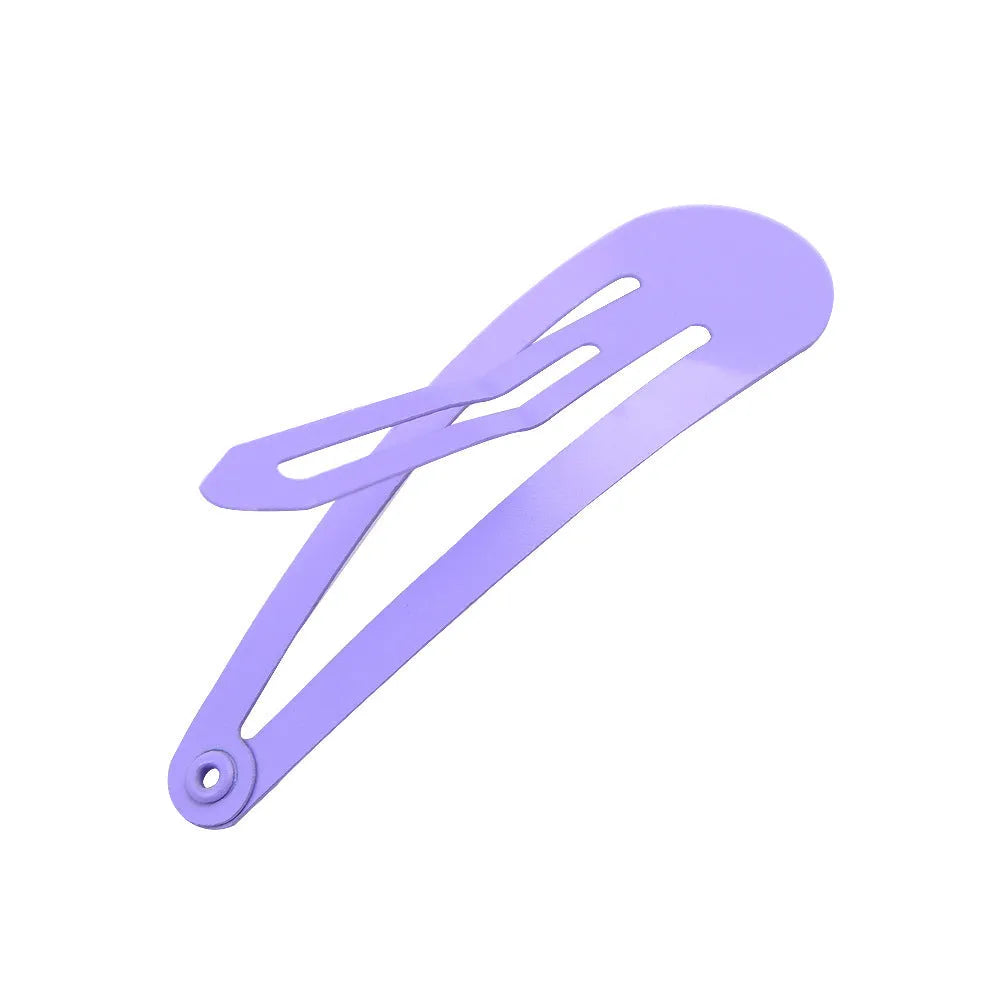 80 metal hair clips in 20 different colours spread out, each measuring 2 inches.