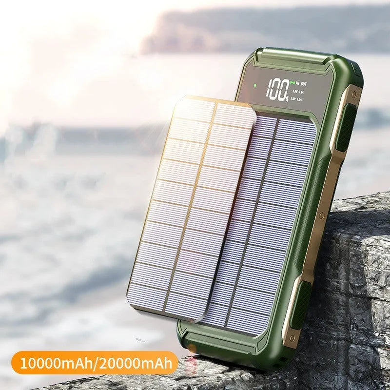 Black military-grade mobile power bank showing size next to a smartphone