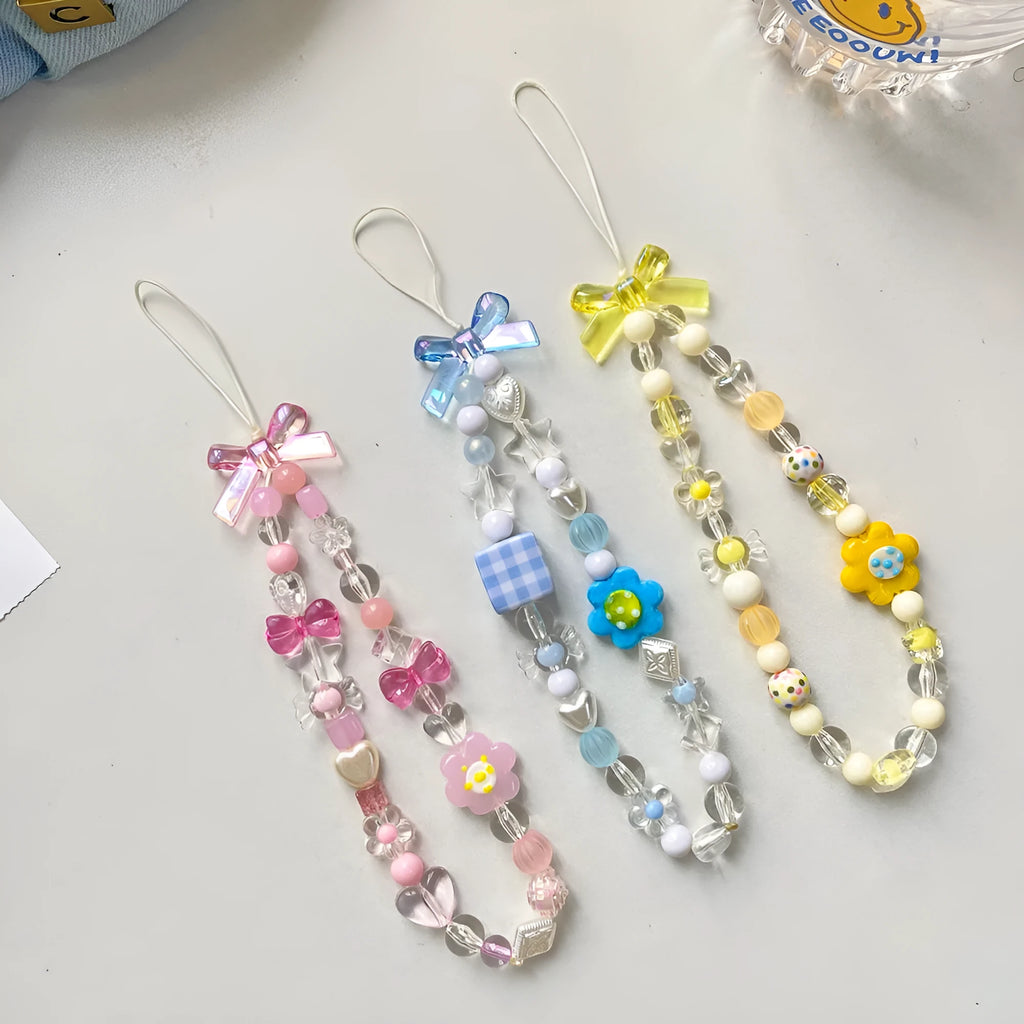 A blue beaded flower mobile phone lanyard with a hand rope design, measuring 1 metre long.