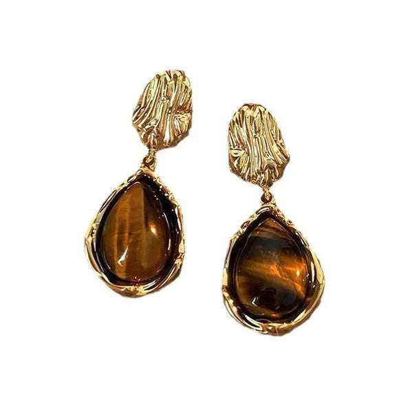 Three pairs of handmade geometric alloy earrings with tassels in Maillard, Amber, and Tigereye styles.