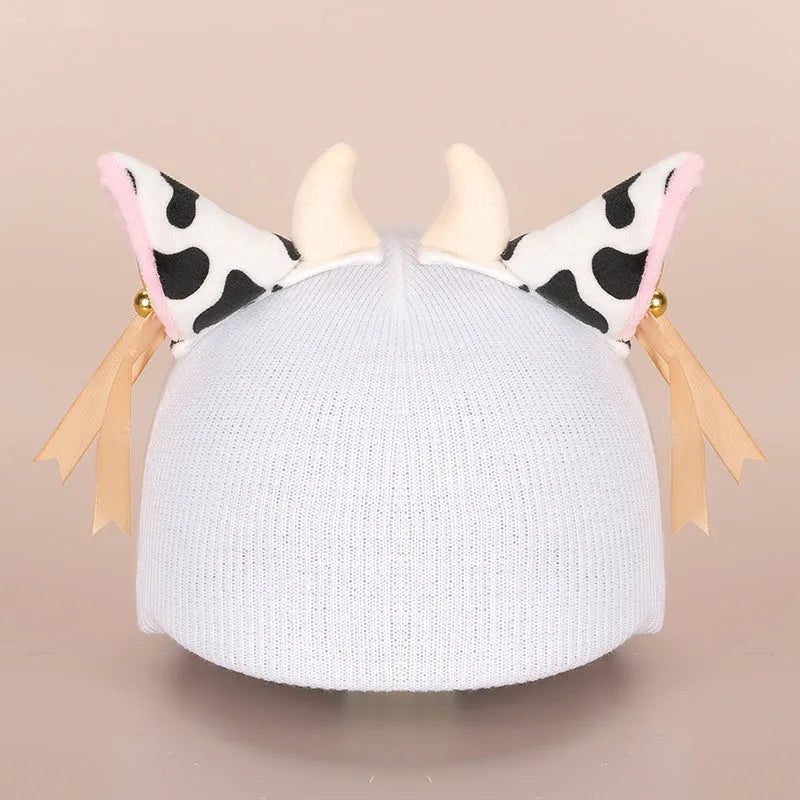 Soft plush cartoon character cover stretched over a pair of black on-ear headphones.