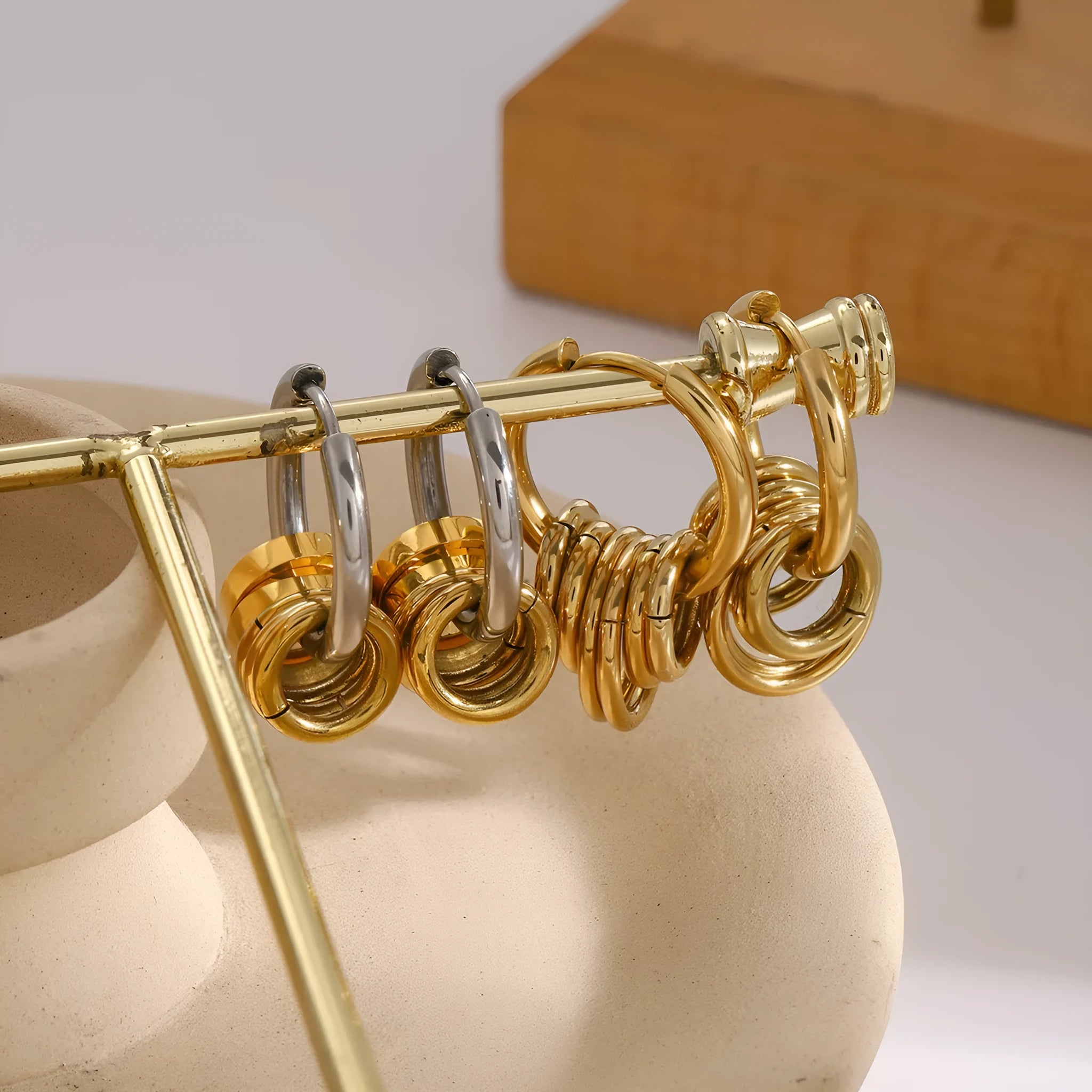 A pair of modern stainless steel earrings with an electroplated colour finish in a unisex ins style.
