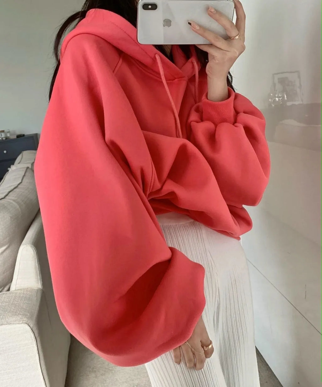 Watermelon red mulberry silk hooded sweater on a hanger, showing loose sleeveless fit.