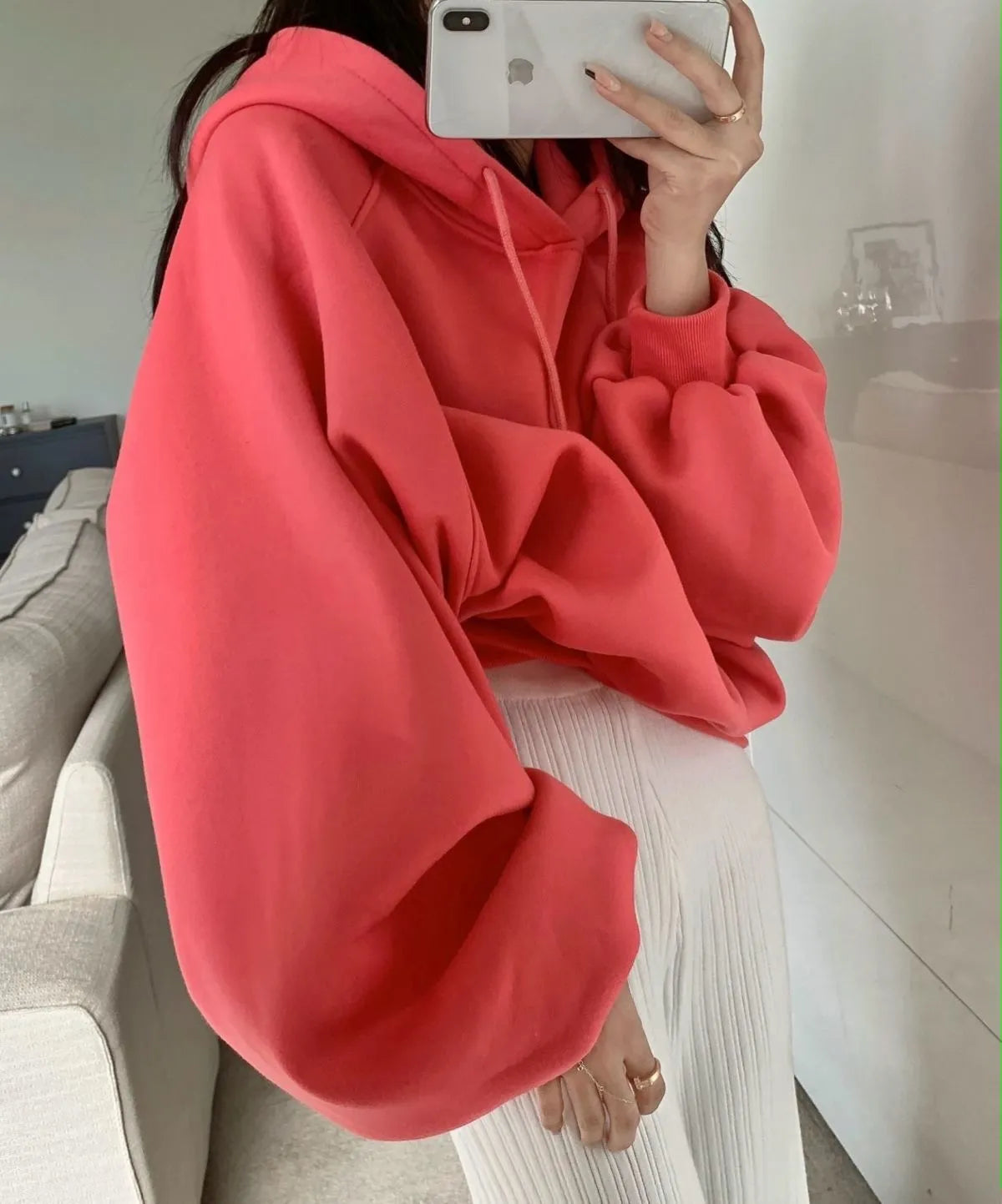 Watermelon red mulberry silk hooded sweater on a hanger, showing loose sleeveless fit.