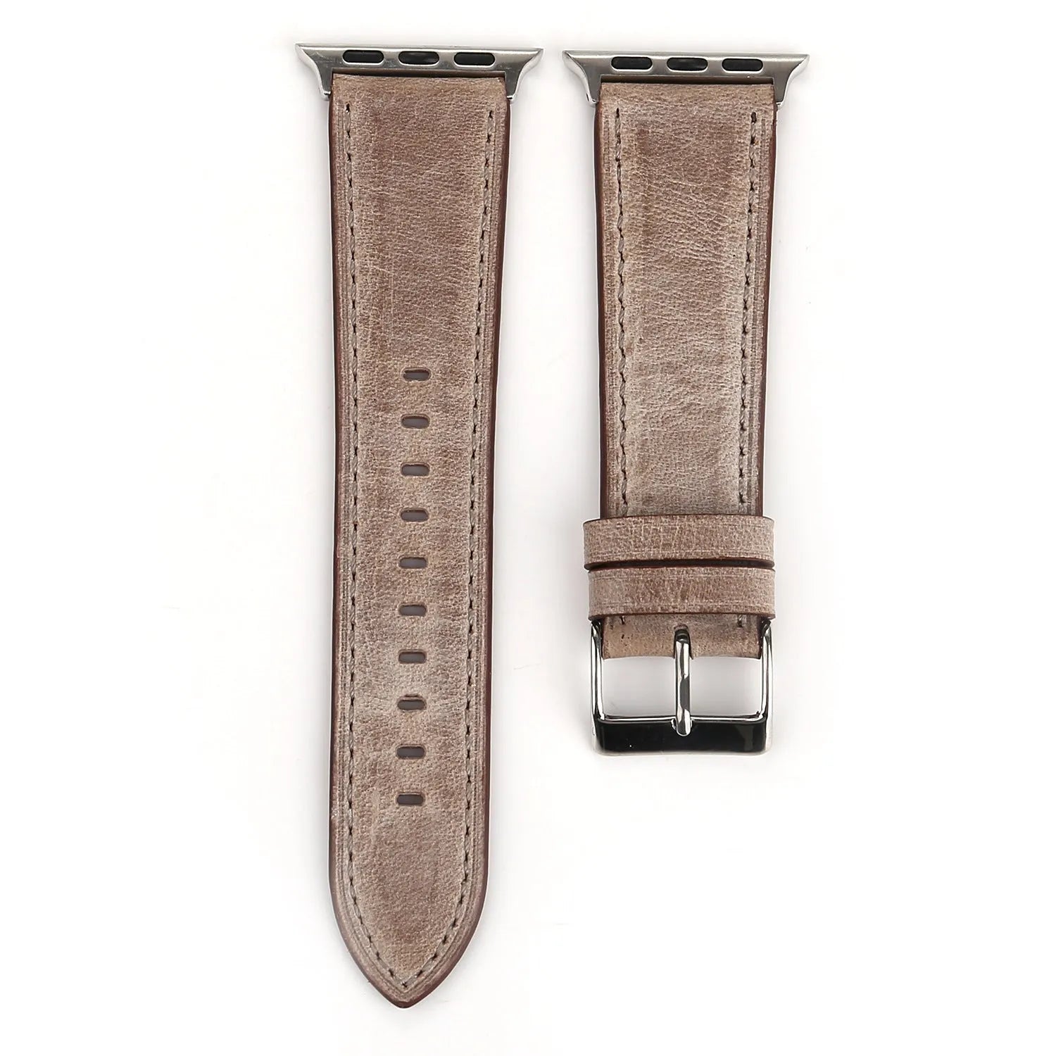 Leather watch strap with a metal folding buckle on a wooden surface.