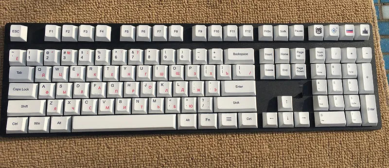 PBT sublimation keycap set showing Japanese, Russian, and Korean characters on mechanical keyboard keys
