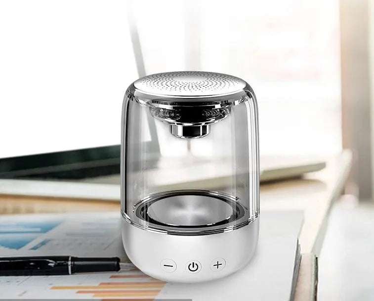 Portable Bluetooth speaker with powerful bass, variable colour LED light, compact size 90x68mm in black