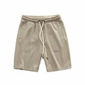 Men's retro loose knitted shorts in polyester, long leg, mid-waist, available in khaki, grey, and black, sizes M to XXXL