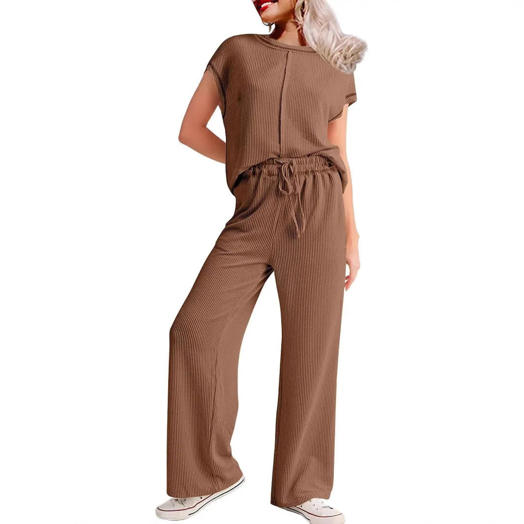 Women's pants set with three-quarter sleeve top and loose trousers in solid colour polyester