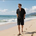 Linen blend leisure suit consisting of a short sleeve shirt and matching shorts in a neutral colour.