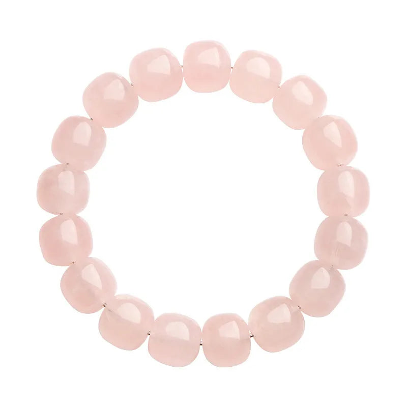 Pink crystal bamboo bracelet with 11x12mm geometric barrel beads on a wrist.