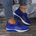 Women's lace-up flat shoes with mesh upper and platform heel in black, dark blue, or red colour options