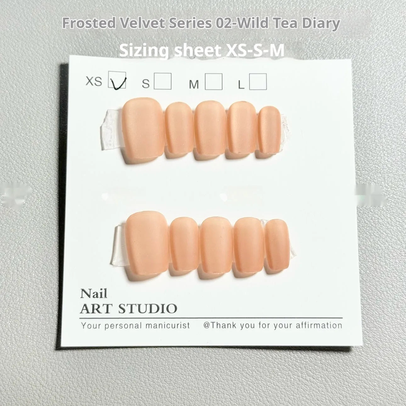 Set of velvet frosted Cat's Eye artificial nails with Aurora armour effect in short ladder XS, S, and M sizes.