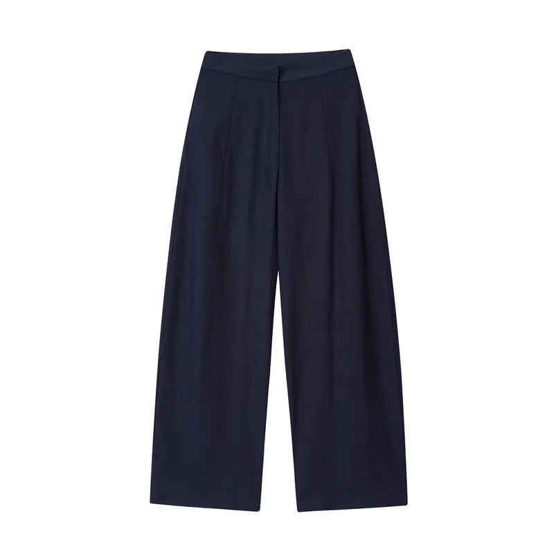 Women's high-neck blouse with flounced sleeves and matching wide-leg trousers in a formal suit set.