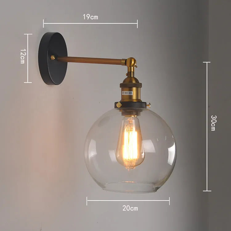Retro round glass ball wall lamp in amber finish, 20cm diameter, with E27 holder.
