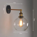 Retro round glass ball wall lamp in amber finish, 20cm diameter, with E27 holder.