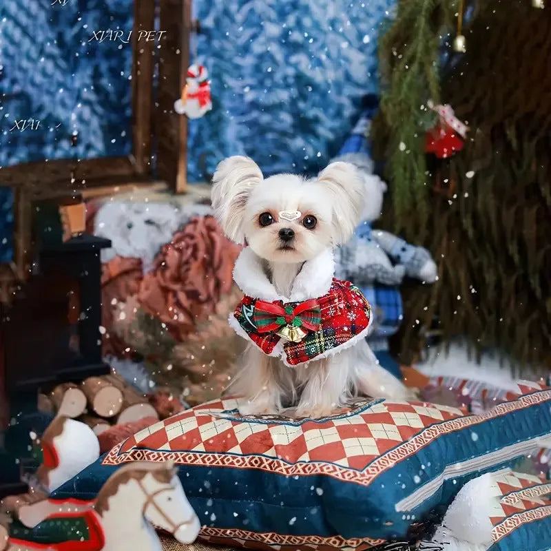 Red festive dog scarf with bell pattern tied around a pet's neck for Christmas.
