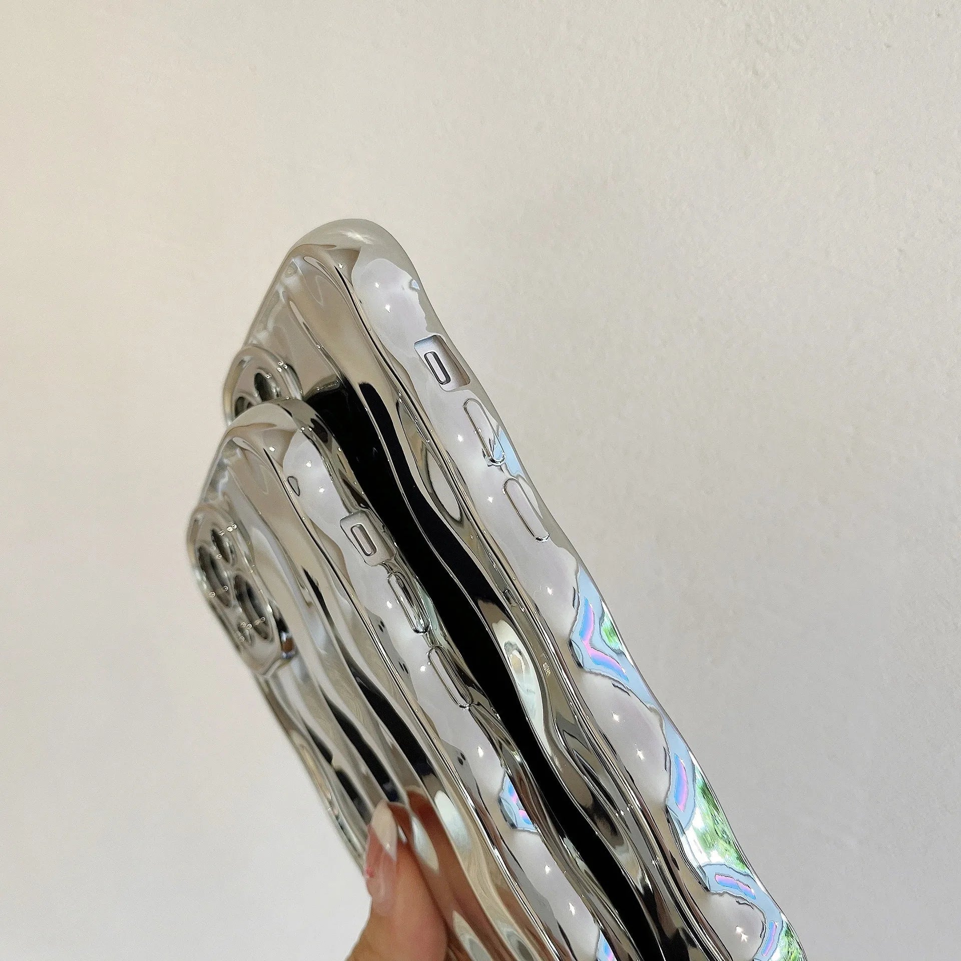 Electroplated wave stripe design protective phone case for iPhone 17 models in various colours.