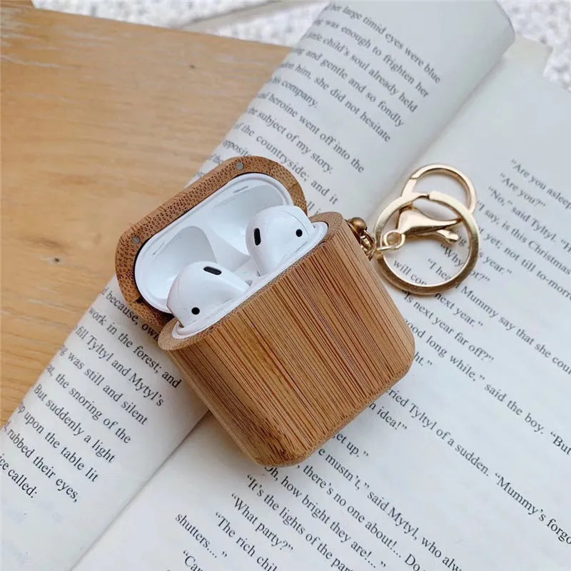 Wood grain clamshell earphone cover for AirPods 1 or 2 in carbonized wood colour, made from wood or bamboo.