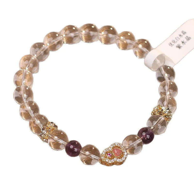 Natural white crystal bracelet for women with transparent gourd detail on light background