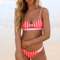 Women's adjustable-strap bikini swimsuit in red and white stripes or black and white polka dots